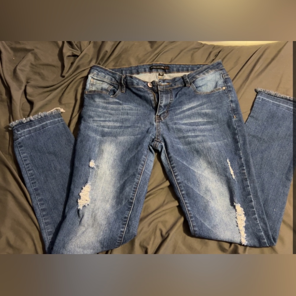 Distressed blue jeans